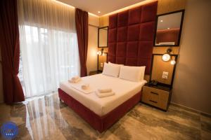 Postel nebo postele na pokoji v ubytování Blue Water Hotel Ksamil
