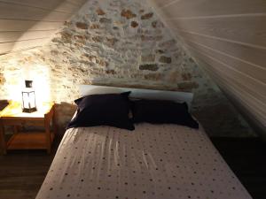 Säng eller sängar i ett rum på La Perle Du Causse