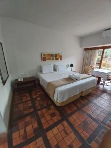 Amoaras Resort tesisinde bir odada yatak veya yataklar