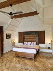 a bedroom with a large bed in a room at Nostravila in Lonavala