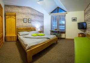 Postel nebo postele na pokoji v ubytování Apartmany Jasna Veverica