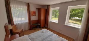 Postel nebo postele na pokoji v ubytování Schillers Landhaus