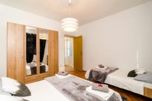 Postel nebo postele na pokoji v ubytování Apartment Eulalija