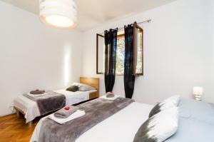 Postel nebo postele na pokoji v ubytování Apartment Eulalija