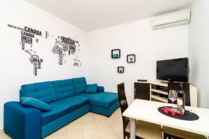 TV a/nebo společenská místnost v ubytování Apartment Eulalija