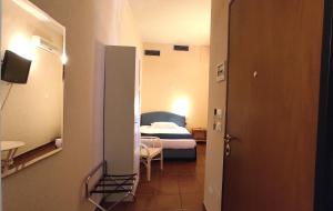 Postel nebo postele na pokoji v ubytování Hotel Rita Major