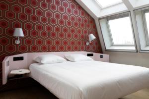 Postel nebo postele na pokoji v ubytování De 6 Linden Boutique Hotel