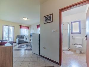 a bathroom with a shower and a toilet in a room at Villa Emilia in Banjole +108 photos