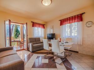 a living room with a couch and a table at Villa Emilia in Banjole