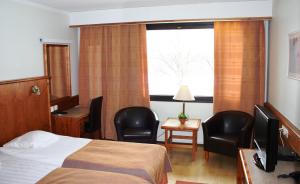 Postel nebo postele na pokoji v ubytování Hotel Ivalo