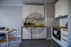 Kuchyň nebo kuchyňský kout v ubytování Chill Apartments City Link