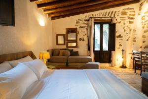 Ένα ή περισσότερα κρεβάτια σε δωμάτιο στο Borgo delle Pietre