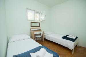 Postel nebo postele na pokoji v ubytování Villa Garina 1