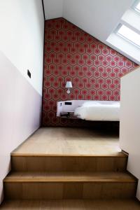 Postel nebo postele na pokoji v ubytování De 6 Linden Boutique Hotel