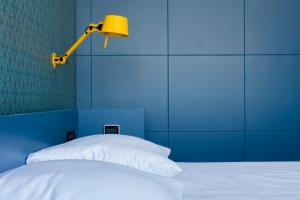 Postel nebo postele na pokoji v ubytování De 6 Linden Boutique Hotel