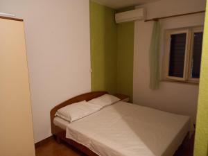 Postel nebo postele na pokoji v ubytování Astra apartman