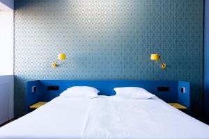 Postel nebo postele na pokoji v ubytování De 6 Linden Boutique Hotel
