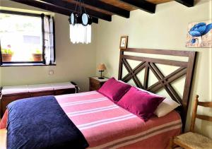 En eller flere senger på et rom på Casa Las Hortensias 2 Pendueles