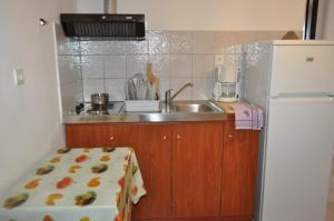 Kuchyň nebo kuchyňský kout v ubytování Giannis Maria Apartments