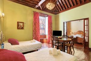 A bed or beds in a room at Apto El balcón de la Catedral
