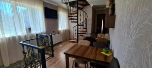 A television and/or entertainment centre at Kazbegi Inn