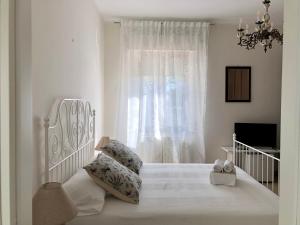 Säng eller sängar i ett rum på A CASA DI TATI