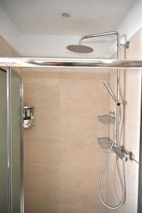 a shower with a glass door in a bathroom at Great Location Private Entrance in Monterosso al Mare