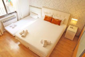 Posteľ alebo postele v izbe v ubytovaní Bcn-rentals apartments in the Old town