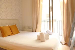 Posteľ alebo postele v izbe v ubytovaní Bcn-rentals apartments in the Old town