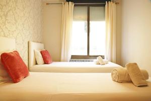 Posteľ alebo postele v izbe v ubytovaní Bcn-rentals apartments in the Old town