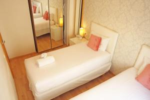 Posteľ alebo postele v izbe v ubytovaní Bcn-rentals apartments in the Old town