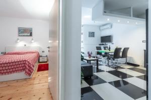 Televízia a/alebo spoločenská miestnosť v ubytovaní Apartment Giorgio