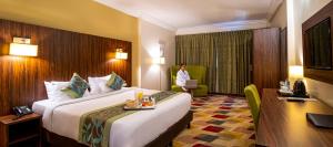 Alisa Hotel North Ridge客房内的一张或多张床位