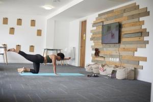 a woman doing a yoga pose in a room at For Students Only Stoneworks in Brighton in Brighton & Hove