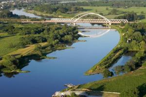 an aerial view of a bridge over a river at Ferienwohnung mit Elbwiesenblick in Lutherstadt Wittenberg