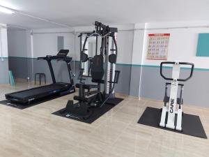 a gym with two tread machines in a room at La Gomera in Gran Tarajal