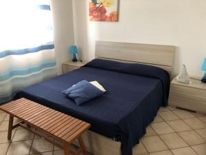 Кровать или кровати в номере I colori del Sinis