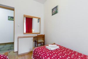 Ein Bett oder Betten in einem Zimmer der Unterkunft Apartments Maria