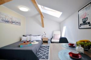 Łóżko lub łóżka w pokoju w obiekcie Plaża Apartament