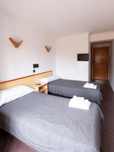 Postel nebo postele na pokoji v ubytování Hostal Gabás