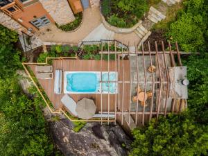 an overhead view of a swimming pool on a fence at Altitude Ski Inout 3 Bdrs W Sauna And Hot Tub in Mont-Tremblant