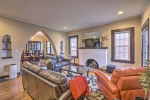 a living room with leather furniture and a fireplace at Cozy Birmingham Abode Less Than 7 Mi to Downtown Fun! in Birmingham