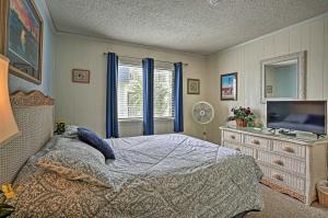 A bed or beds in a room at Coastal Condo with Pool Access - Walk To Beach!