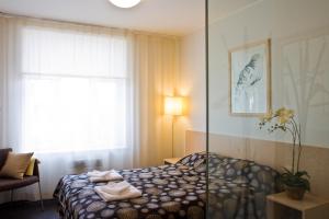 Postel nebo postele na pokoji v ubytování Art Hotell