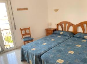 Posteľ alebo postele v izbe v ubytovaní Apartaments Club Nautic L'Escala