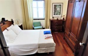 Ένα ή περισσότερα κρεβάτια σε δωμάτιο στο Quinta dos Reis +22 φωτογραφίες