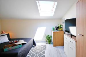 Telewizja i/lub zestaw kina domowego w obiekcie Plaża Apartament