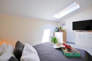 Telewizja i/lub zestaw kina domowego w obiekcie Plaża Apartament