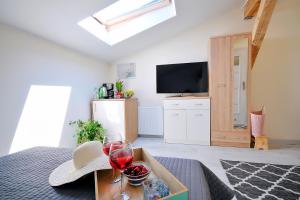 Telewizja i/lub zestaw kina domowego w obiekcie Plaża Apartament