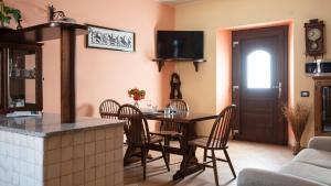 a kitchen and dining room with a table and chairs at Welcomely - Pan di Zucchero 12 - Nebida in Nebida